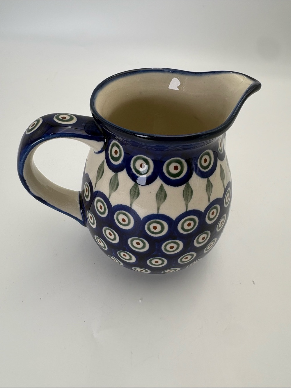 Hand-painted Polish Pottery Pitcher in Blue Peacock Pattern with Green Accents